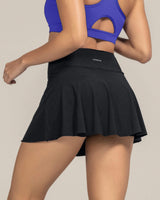 Falda deportiva con short interno con bolsillo#color_700-negro